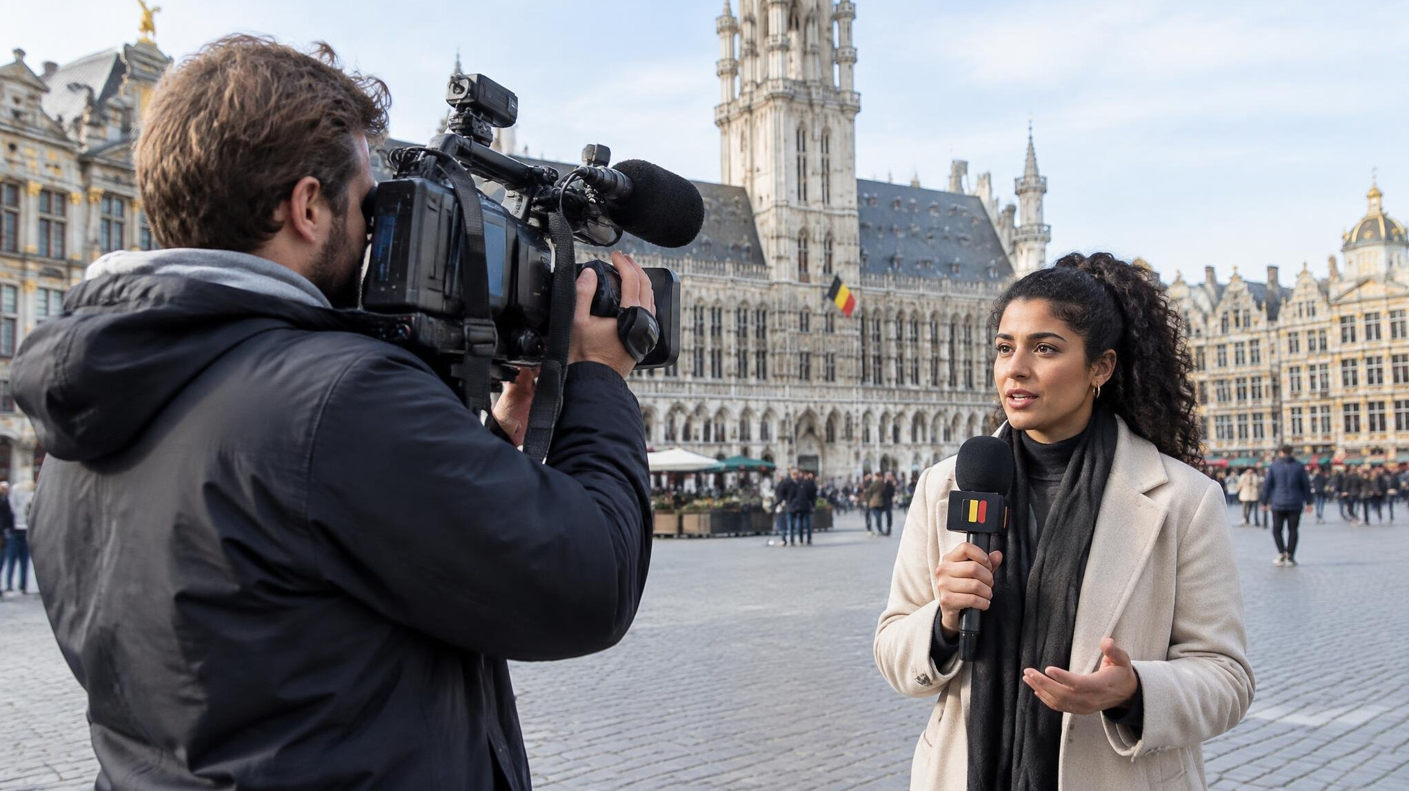 Camera crew filming an outdoor news report in a European city